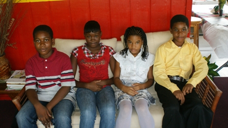 The four students who were awarded from the NevCan Cultural Association (L-R) Master Celvin Maynard, Ms. Anjonique Browne, Ms. Nelita Williams and Master Antonio Mills